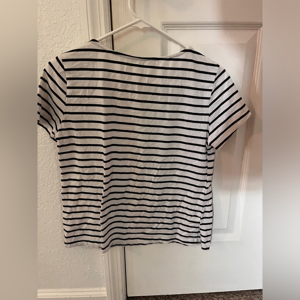 Small black and white striped T-shirt.